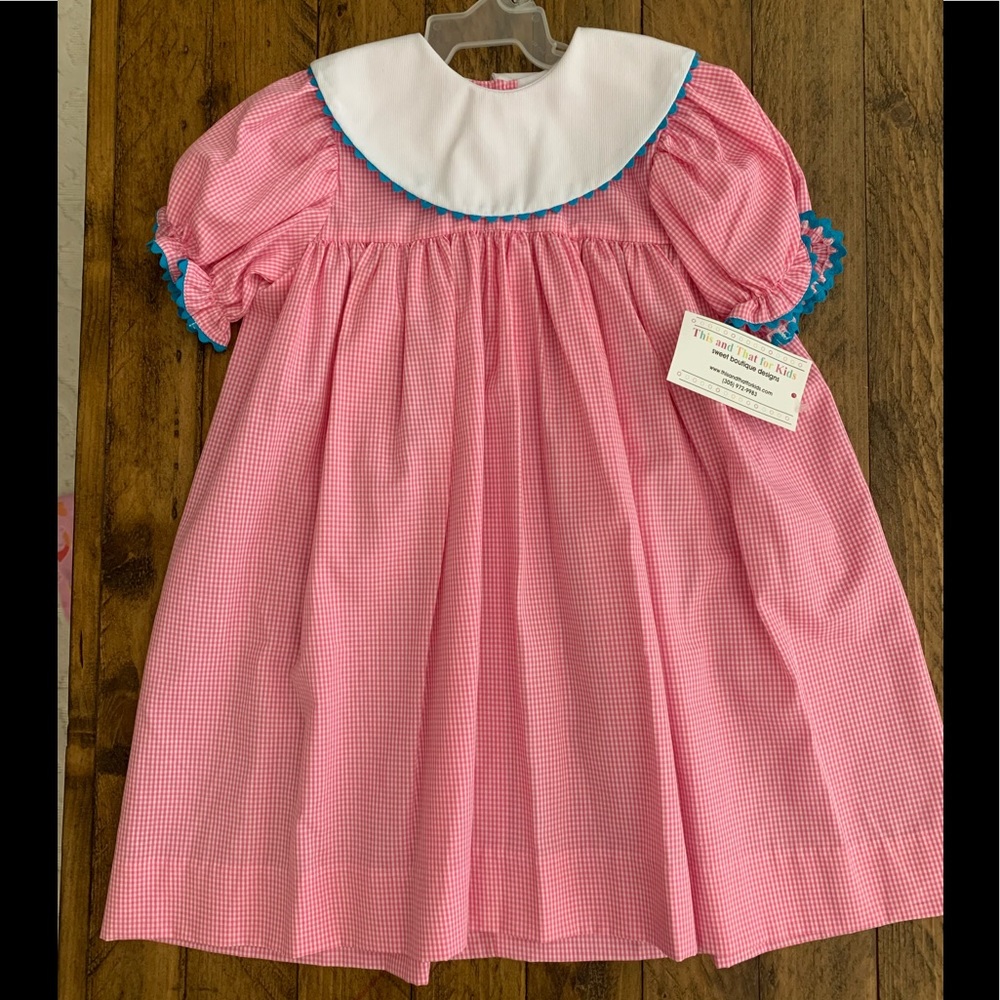 Pink gingham bishop dress.